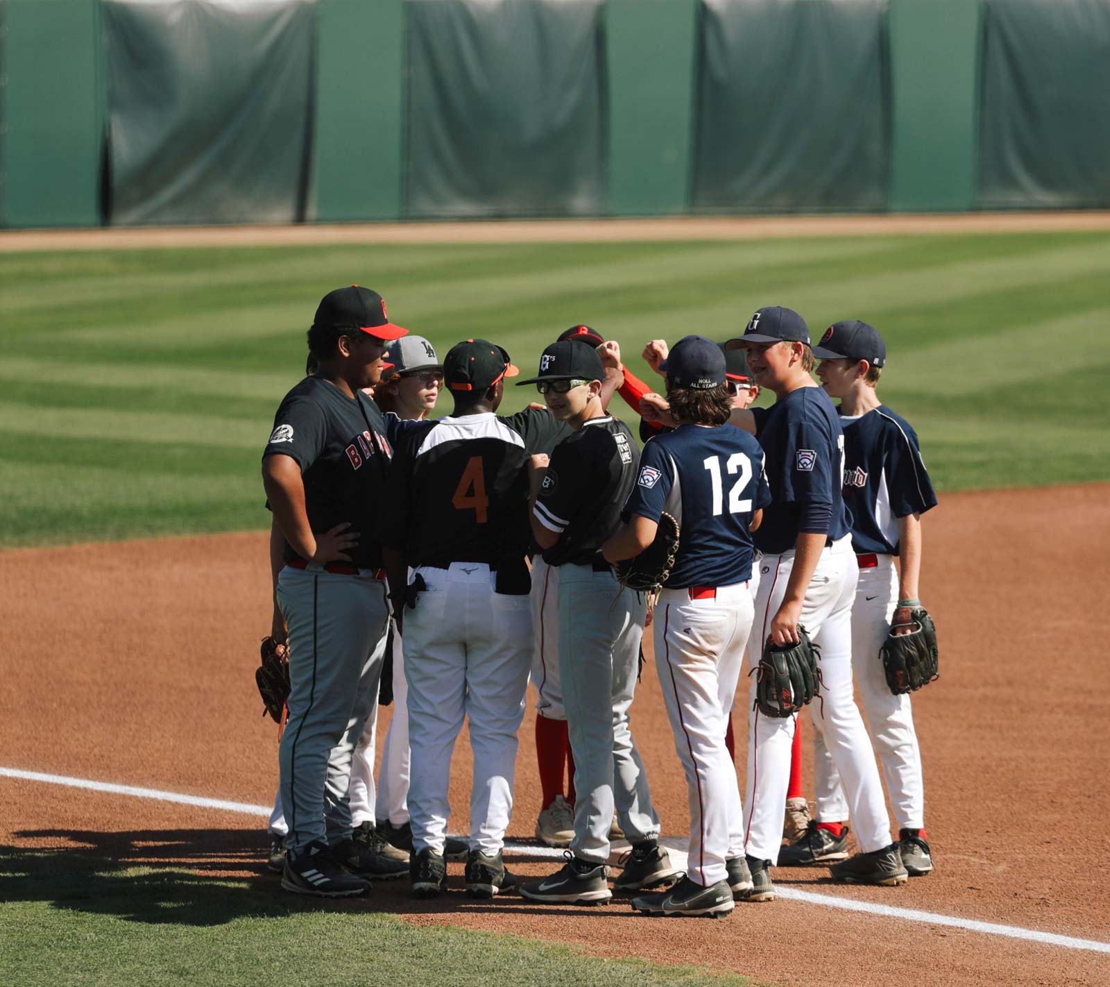 Little League players on a baseball field. Raimondi Park.